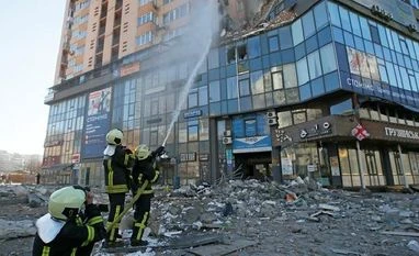 Russian troops will attempt to occupy Kyiv in next few days: Official Firefighters extinguish fire in an apartment building damaged by recent shelling in Kyiv