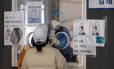 China tightens controls in Shanghai as more virus cases reported covid