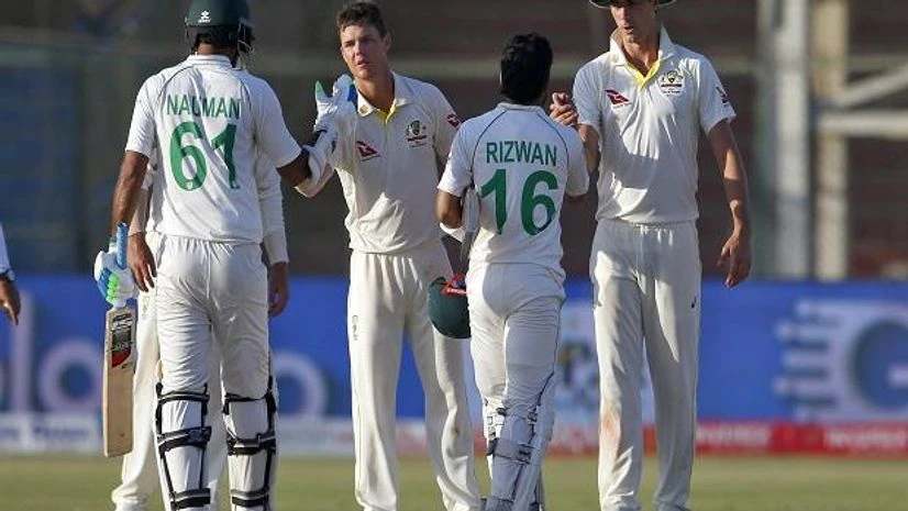 Australia's Pat Cummins, left, and Mitchell Swepson, center, shake hands with Pakistan's Mohammad Rizwan and Nauman Ali on the end of the play of second test match between Pakistan and Australia at the National Stadium in Karachi (Photo: AP/PTI) Pakistan Australia cricket match