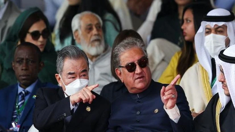 Pakistan's Foreign Minister Shah Mahmood Qureshi and Chinese Foreign Minister Wang Yi, gesture as they attend Pakistan Day military parade in Islamabad (Photo: Reuters) Pakistan's Foreign Minister Shah Mahmood Qureshi and Chinese Foreign Minister Wang Yi, gesture as they attend Pakistan Day military parade in Islamabad (Photo: Reuters)