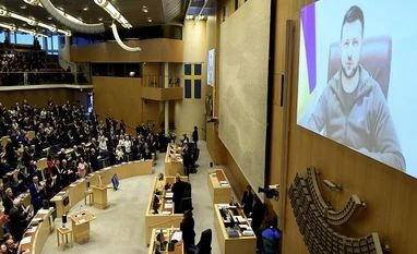 Ukraine's President Volodymyr Zelensky receives a standing ovation as he adresses the Sweden's parliament via video link, in Stockholm (Photo: AP/PTI) Volodymyr Zelensky