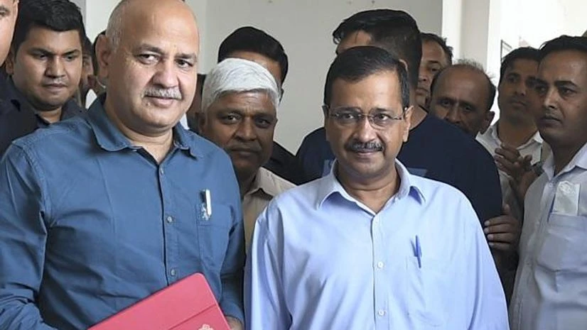 Delhi Dy CM and Finance Minister Manish Sisodia with Chief Minister Arvind Kejriwal before presenting the annual budget 2022-23 in Delhi Assembly, in New Delhi (Photo: PTI) Delhi Dy CM and Finance Minister Manish Sisodia with Chief Minister Arvind Kejriwal before presenting the annual budget 2022-23 in Delhi Assembly, in New Delhi (Photo: PTI)