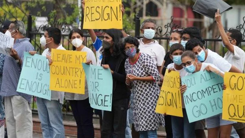 sri lanka crisis Sri Lankans participate in a protest demanding president Gotabaya Rajapaksa resign, before the beginning of curfew in Colombo, Sri Lanka, Saturday, April 2, 2022. (AP Photo/Eranga Jayawardena)