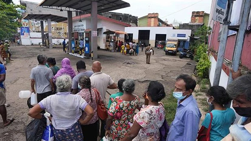 Sri Lankan, Colombo, fuel station Sri Lankans queue up at a fuel station to buy kerosene in Colombo, Sri Lanka. Photo: AP/PTI
