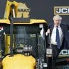 Britain's Prime Minister Boris Johnson climbs onto a JCB at the new JCB Factory in Vadodara, in India's Gujarat state, part of two day trip to India. (Photo: AP/PTI)