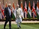 Narendra Modi, Boris Johnson Prime Minister Narendra Modi talks with his British counterpart Boris Johnson before their delegation level talks in New Delhi, Friday, April 22, 2022. (AP Photo/Manish Swarup)