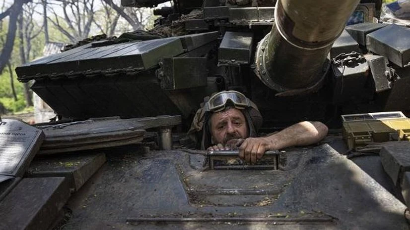 ukraine russia A Ukrainian serviceman enters a tank during the repair works after fighting against Russian forces in Donetsk region, eastern Ukraine, Wednesday, April 27, 2022. (AP Photo/Evgeniy Maloletka)