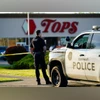 US shooting A police officer stands guard outside the scene of a shooting at a supermarket, in Buffalo, N.Y., Sunday, May 15, 2022. (AP Photo/Matt Rourke)