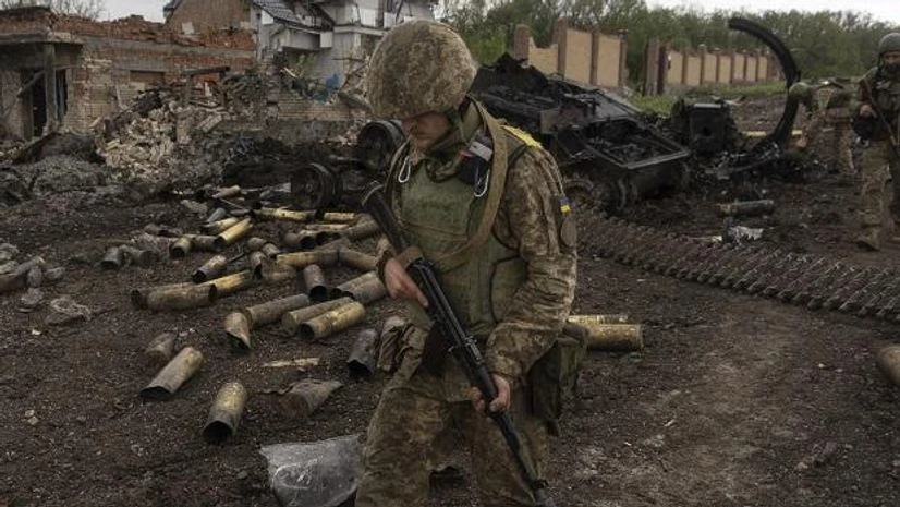 russia ukraine Ukrainian servicemen patrol in a recently retaken village, north of Kharkiv, east Ukraine, Sunday, May 15, 2022. (AP/PTI Photo)