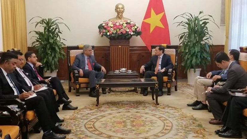 MEA Secretary (East) Saurabh Kumar with Vietnamese FM Bui Thanh Son MEA Secretary (East) Saurabh Kumar with Vietnamese FM Bui Thanh Son in Hanoi. (Photo: Twitter/@MEAIndia)