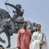 Bollywood actor Akshay Kumar and actor Manushi Chhillar pose for photographs near the statue of Prithviraj Chauhan at Qila Rai Pithora, during their visit to the national capital for promotion of their upcoming film Samarat Prithviraj, in New Delhi (