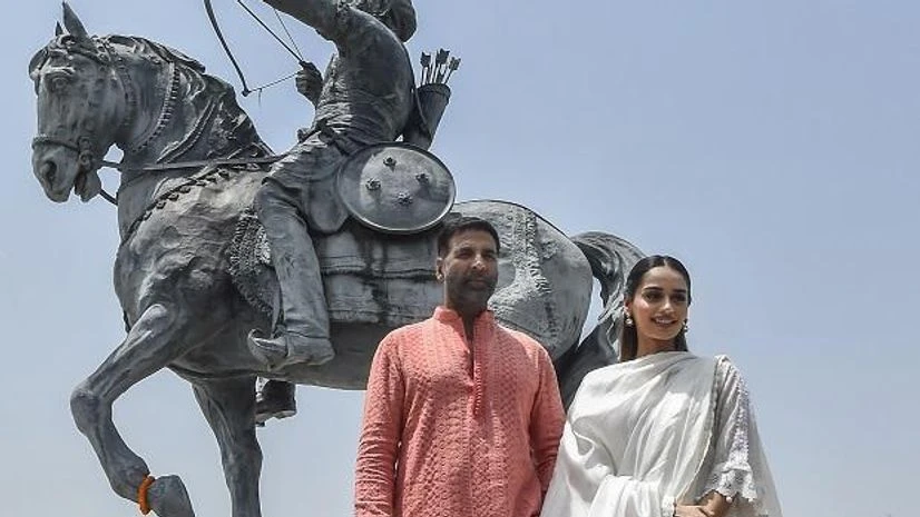 Samarat Prithviraj Bollywood actor Akshay Kumar and actor Manushi Chhillar pose for photographs near the statue of Prithviraj Chauhan at Qila Rai Pithora, during their visit to the national capital for promotion of their upcoming film Samarat Prithviraj, in New Delhi (