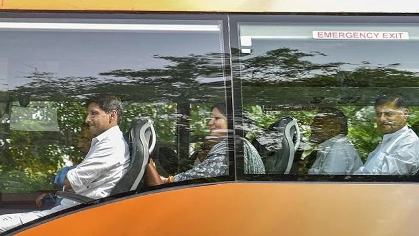 Haryana Congress MLAs Haryana Congress MLAs being shifted from the residence of party MP Deepender Hooda (L), where they had gathered ahead of voting for Rajya Sabha polls, in New Delhi (Photo: PTI)