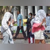 Delhi heatwaves Women cover their faces with scarves to protect themselves from the heat on a hot summer day, in New Delhi (Photo: PTI)