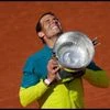 Spain's Rafael Nadal lifts the trophy after winning the final match against Norway's Casper Ruud in three sets, 6-3, 6-3, 6-0, at the French Open tennis tournament in Roland Garros stadium in Paris, France, Sunday, June 5, 2022. (AP Photo/Christophe