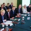 British Culture Secretary Nadine Dorries, Attorney General Suella Braverman and Chancellor of the Exchequer Rishi Sunak listen as British Prime Minister Boris Johnson addresses his cabinet ahead of the weekly cabinet meeting in Downing Street, London