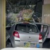 A car has crashed into a store after crashing into a crowd of people in central Berlin, Germany, Wednesday, June 8, 2022. (AP Photo/Michael Sohn)