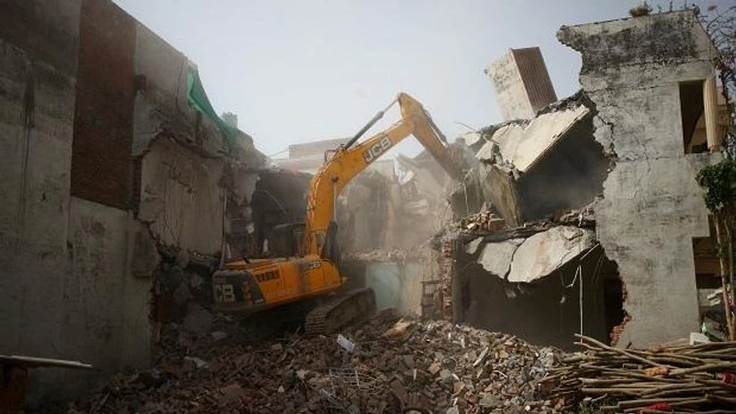 bulldozer, demolition, Uttar Pradesh, Communal violence A bulldozer demolishes the house of a Muslim man that Uttar Pradesh authorities accuse of being involved in riots last week, that erupted following comments about the Prophet Mohammed by Bharatiya Janata Party (BJP) members, in Prayagraj (Photo: Reut