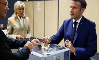 French head to polls as Macron battles for majority in parliament French President Emmanuel Macron casts his vote in the first round of French parliamentary elections, at a polling station in Le Touquet