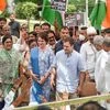 Congress leader Rahul Gandhi with Priyanka Gandhi meets party workers at the AICC headquarters before leaving for the Enforcement Directorate office to appear in the National Herald case, in New Delhi (Photo: PTI)