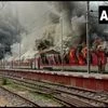 Train set ablaze by protestors in Bihar over Agnipath scheme. Photo: ANI