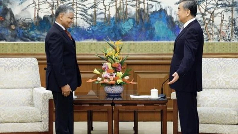 India China ties, Wang Yi, Pradeep Kumar Rawat Indian Ambassador to China Pradeep Kumar Rawat (left) meets Chinese Foreign Minister Wang Yi