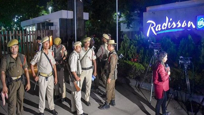 Maharashtra rebel MLAs, Guwahati Security personnel stand guard outside the Radisson Blu hotel, where Maharashtra's MLAs are staying, in Guwahati (Photo: PTI)