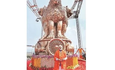 PM Modi unveils national emblem atop Parliament building, Oppn slams move modi