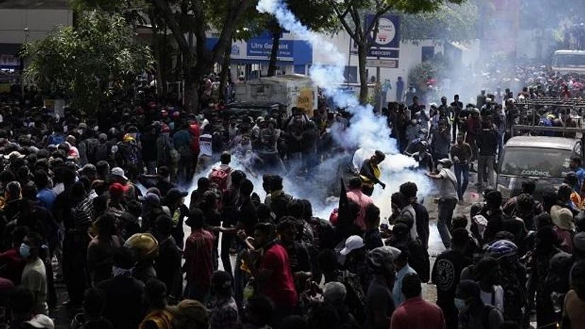Sri Lanka protests Protestors throw back teargas shells as they rally outside prime minister Ranil Wickremesinghe's office, demanding he resign after president Gotabaya Rajapaksa fled amid economic crisis in Colombo, Sri Lanka (Photo: AP/PTI)