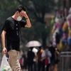 A man wearing face mask reacts on a street amid a heatwave warning, following the coronavirus disease outbreak in Shanghai (Photo: Reuters)