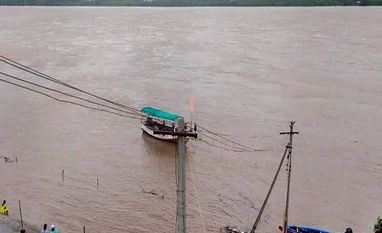 Krishna river flood level slowly rising in AP, first warning signal issued Swollen Godavari river following incessant monsoon rains, in Bhadrachalam (Photo: PTI)