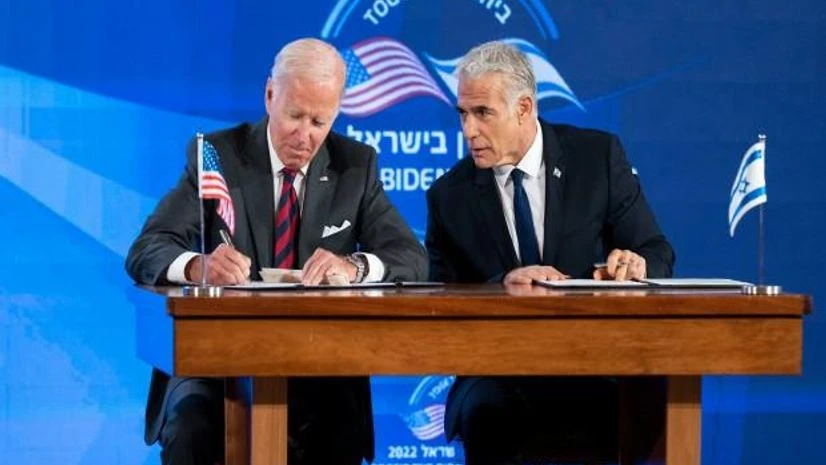 US President Joe Biden and Israeli Prime Minister Yair Lapid sign a joint declaration affirming the 'unbreakable bonds' between the two countries and a US commitment to protecting Israeli security, in Jerusalem (Photo: AP/PTI) US President Joe Biden and Israeli Prime Minister Yair Lapid sign a joint declaration affirming the 'unbreakable bonds' between the two countries and a US commitment to protecting Israeli security, in Jerusalem (Photo: AP/PTI)