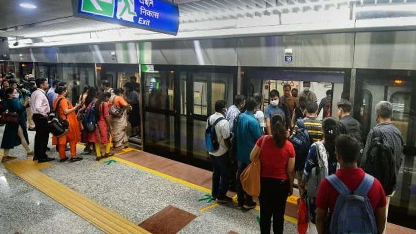 Commuters board a metro at a platform as commercial services begin at Sealdah Metro station, which connects IT hub of Sector V on the extended part of the East-West metro corridor, in Kolkata (Photo: PTI) Commuters board a metro at a platform as commercial services begin at Sealdah Metro station, which connects IT hub of Sector V on the extended part of the East-West metro corridor, in Kolkata (Photo: PTI)