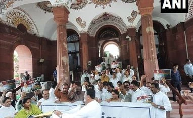 Cong MLAs dump garlic outside MP Assembly for govt's apathy towards farmers Congress MPs protest in Parliament against the Central government over the questioning of party president Sonia Gandhi by the Enforcement Directorate in the National Herald case
