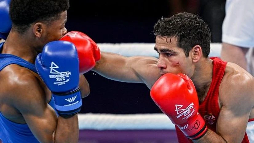 Mohammad Hussamuddin, boxing, CWG, Commonwealth Games Birmingham: India's Mohammad Hussamuddin in action against Namibia's Tryagain Morning during the men's 54kg - 57kg category boxing quarter-final match of the Commonwealth Games 2022 (CWG), in Birmingham, UK, Wednesday, Aug. 3, 2022. (PTI Photo/Swapa