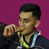 Birmingham: India's Lakshya Sen poses for photos with his gold medal after winning the Men's Singles Final Badminton match against Malaysia's Ng Tze Yong at the Commonwealth Games 2022 (CWG), in Birmingham, UK, Monday, Aug. 8, 2022. (PTI Photo/Swapan