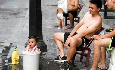 Amid record heat wave, China dims lights in Chengdu subway to save power China, China heatwave