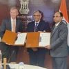 Heads of Agreement being exchanged between Rajesh Kumar Srivastava, Director (Exploration), ONGC (right) and Monte K Dobson , CEO & Lead Country Manager, ExxonMobil India (left), in the presence of Pankaj Jain, Secretary, Ministry of Petroleum & Natu