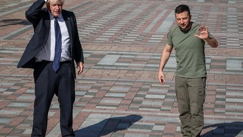 Boris Johnson, Volodymyr Zelensky Ukraine's President Volodymyr Zelensky and British Prime Minister Boris Johnson stand next to a plaque with Johnson's name on the Alley of Bravery after a joint news briefing, amid Russia's attack on Ukraine, in Kyiv (Photo: Reuters)
