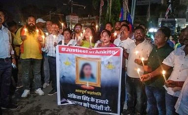 Jharkhand: Woman burnt alive by jilted lover; NCW seeks action taken report People carry a candle light march in protest against the death of a class-12 student, who was allegedly set on fire by a man in Jharkhand's Dumka district, in Ranchi