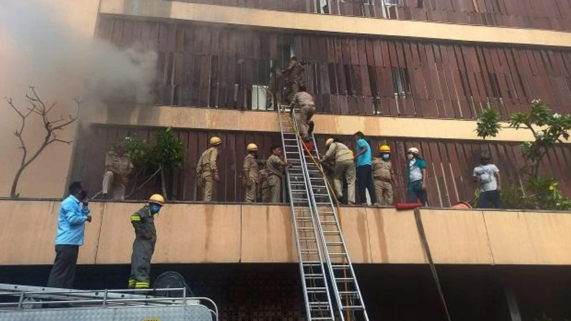 Fire brigade personnel try to evacuate people after a fire broke out in a hotel in Hazratganj area of Lucknow Fire brigade personnel try to evacuate people after a fire broke out in a hotel in Hazratganj area of Lucknow