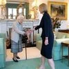 Queen Elizabeth welcomes Liz Truss during an audience where she invited the newly elected leader of the Conservative party to become Prime Minister and form a new government, at Balmoral Castle, Scotland