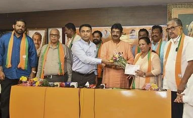 Cabinet reshuffle likely in Goa after 8 Congress MLAs join ruling BJP Goa Chief Minister Pramod Sawant and Goa BJP President Sadanand Shet Tanavade welcome eight Congress MLAs who joined the party, in Panaji (Photo: PTI)