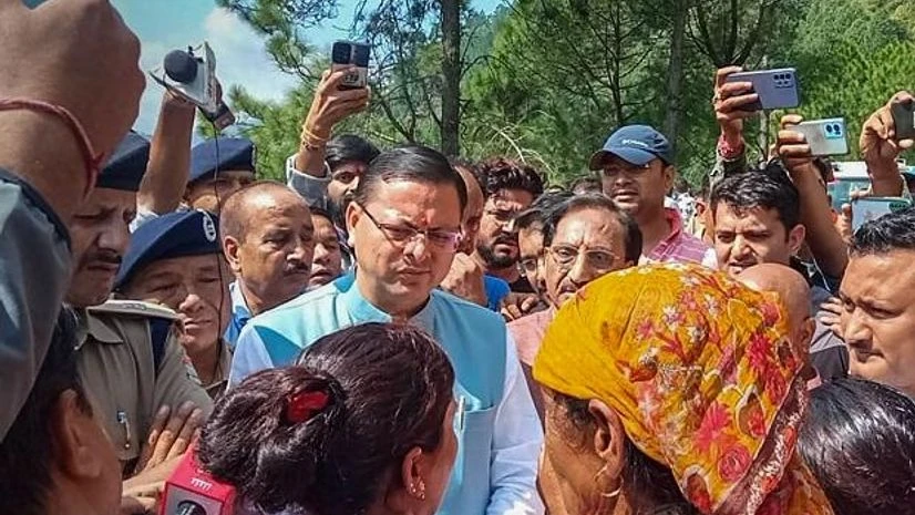 Uttarakhand CM Pushkar Singh Dhami interacts with family members of victims as he oversees rescue oparations after a bus carrying members of a marriage party fell into a gorge on Tuesday evening, in Pauri Garhwal district Uttarakhand CM Pushkar Singh Dhami interacts with family members of victims as he oversees rescue oparations after a bus carrying members of a marriage party fell into a gorge on Tuesday evening, in Pauri Garhwal district