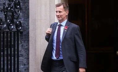 UK's Jeremy Hunt says will hike minimum wage but rules out tax cuts Jeremy Hunt, UK Chancellor