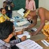 **EDS: TWITTER IMAGE VIA @ECISVEEP** Gir Somnath: A voter from Siddi Community in a traditional attire goes through the election procedure to cast his vote for the 1st phase of the Gujarat Assembly elections, at Madhupur Jambur, in Gir Somnath, Thurs