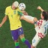 Croatia’s Luka Modric (right) fights for the ball with Brazil’s Richarlison during the quarterfinal match in Al Rayyan on Friday 	Reuters