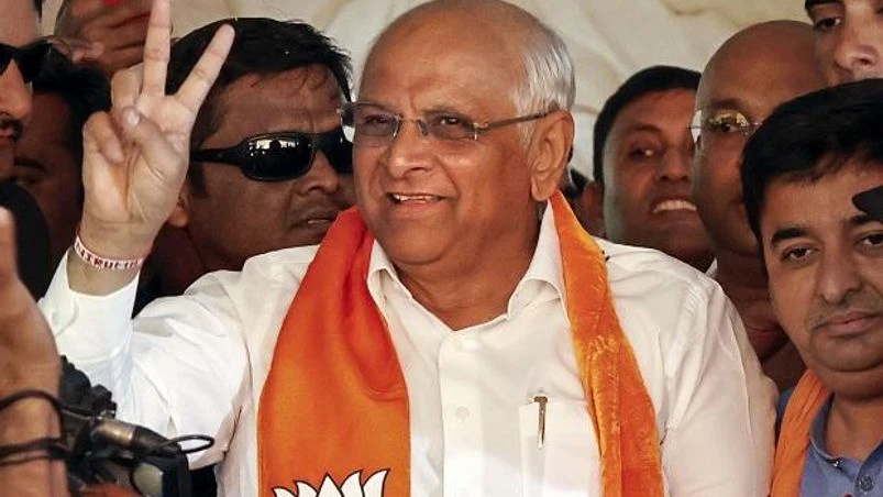 Bhupendra Patel Gujarat Chief Minister and BJP candidate Bhupendra Patel flashes the victory sign celebrating the party's victory in Gujarat Assembly elections, at the party headquarters in Gandhinagar, Thursday, Dec. 8, 2022. (PTI Photo)