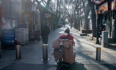 China's economy braces for turmoil as Covid curbs ease, infections surge China, China economy