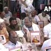 LoP Siddaramaiah and other Congress MLAs protest outside the Assembly against the installation of a portrait of VD Savarkar in the Assembly hall